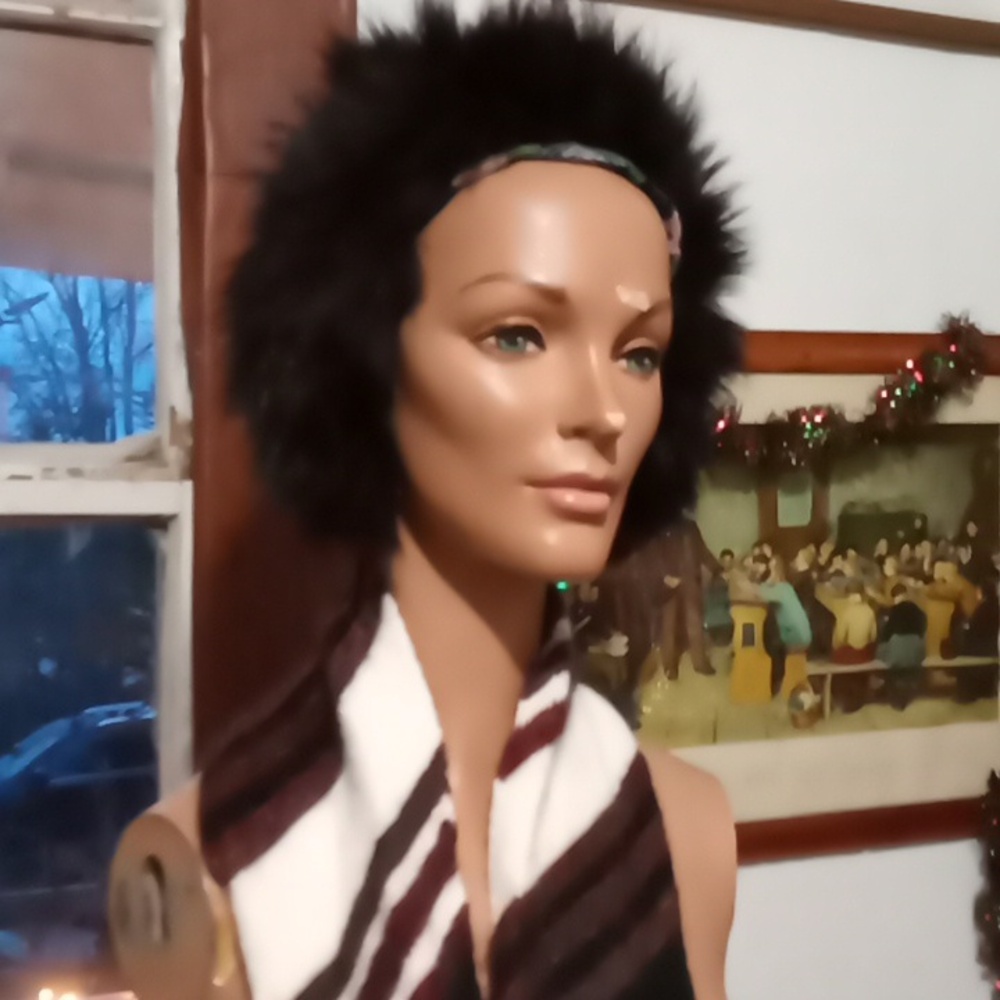 Genuine rabbit fur hat in very good condition. Size M.